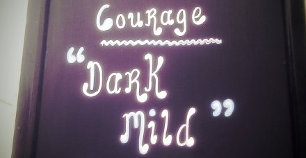Sign outside a Plymouth pub advertising Courage Dark Mild