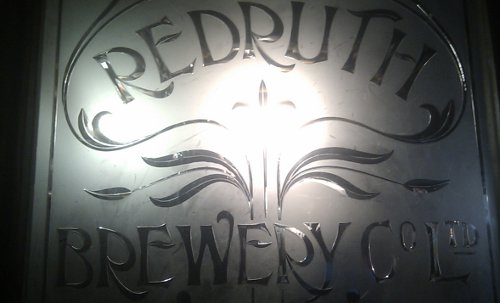 Edwardian glass screen advertising the Redruth Brewery Company Ltd