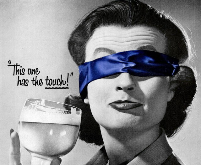 Detail from a vintage beer ad with a blindfolded woman tasting a beer and saying "This one has the touch!"