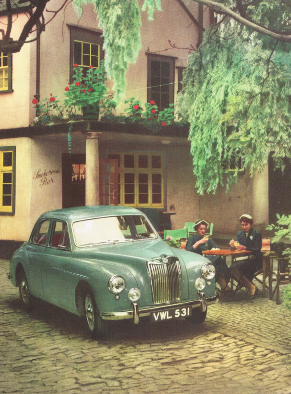 MG Magnette parked outside a pub while two women have orange juice. (And vodka?)