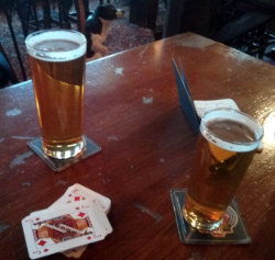 Cribbage in the pub with pints.