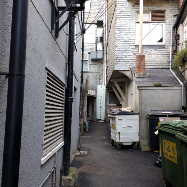 Alleyway up to the front door of the pub.