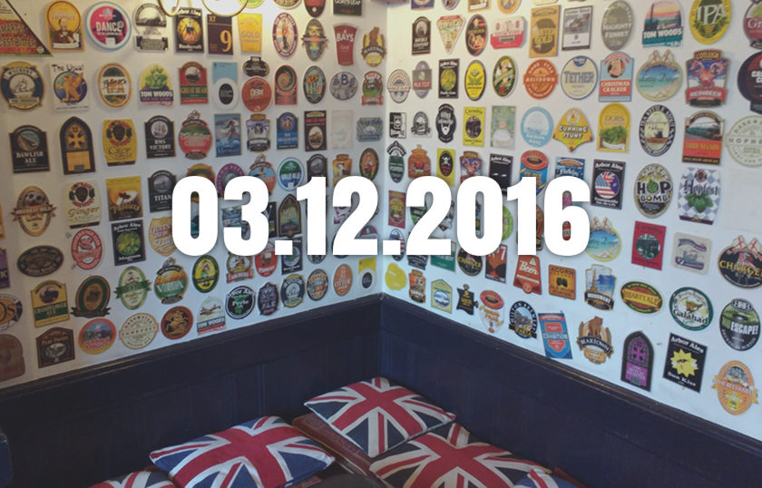 A pub wall decorated with beer pump clips, with date overlaid.