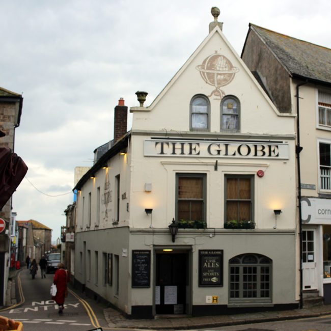 Exterior of The Globe, Penzance, on an overcast day.