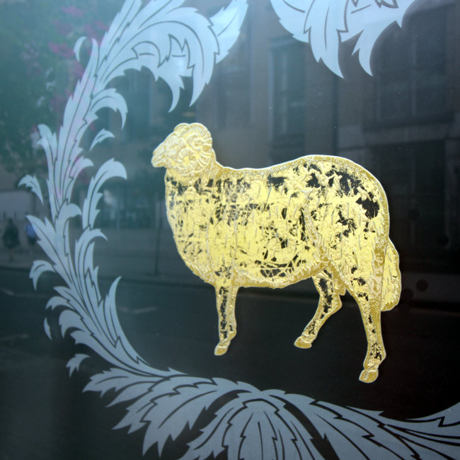 The Young's brewery ram mascot on a London pub window.