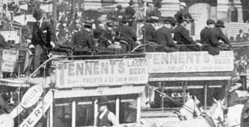 Close up of omnibuses advertising Tennent's Lager