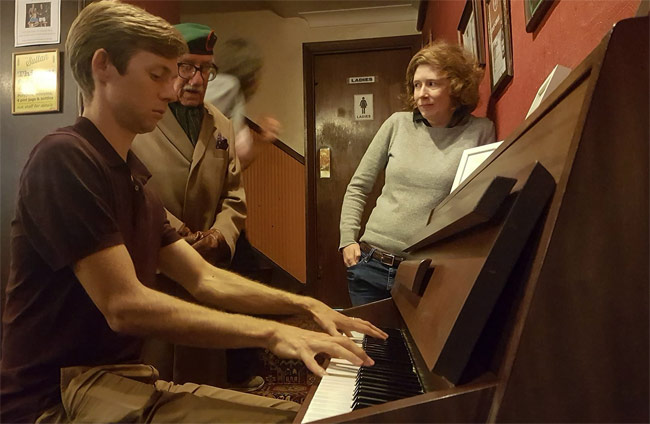 Playing the piano in a London pub.