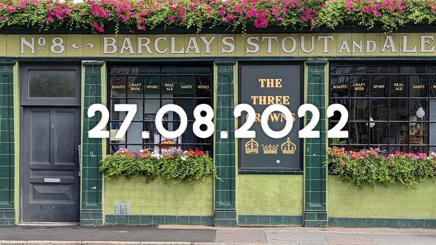 The exterior of a London pub with green tiles and the words Barclay's Stout and Ale.