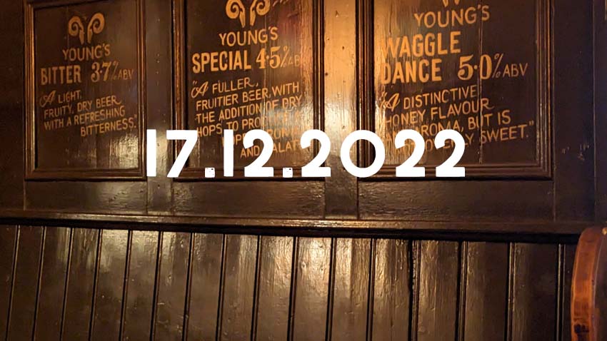 Advertising for Young's beers painted on the wood panelling of the Highbury Vaults in Bristol.
