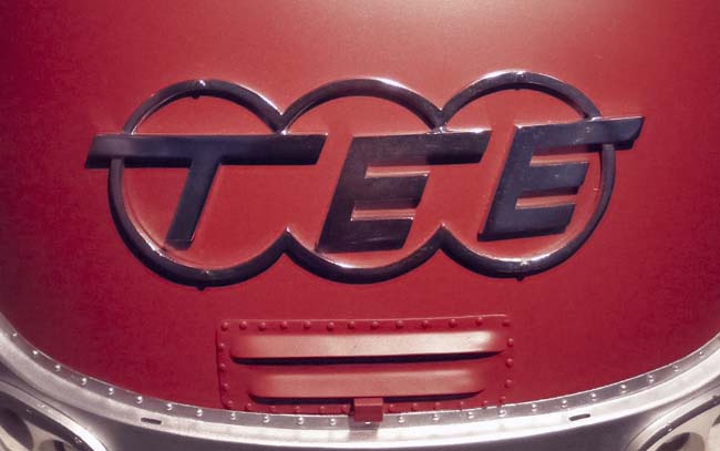 The Trans Europe Express logo on a red train engine.