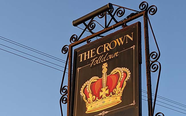 A sign for a pub called The Crown.