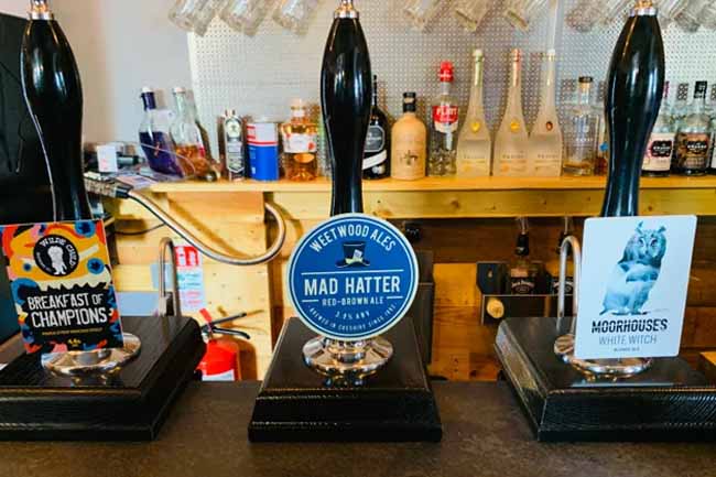 Beer pumps at The Backstage with beer from Weetwood and Moorhouses.
