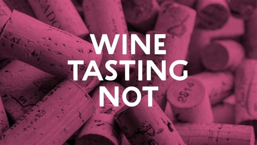 Wine corks overlaid with the text "Wine tasting not".